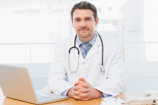 depositphotos_39179963-stock-photo-male-doctor-with-laptop-at